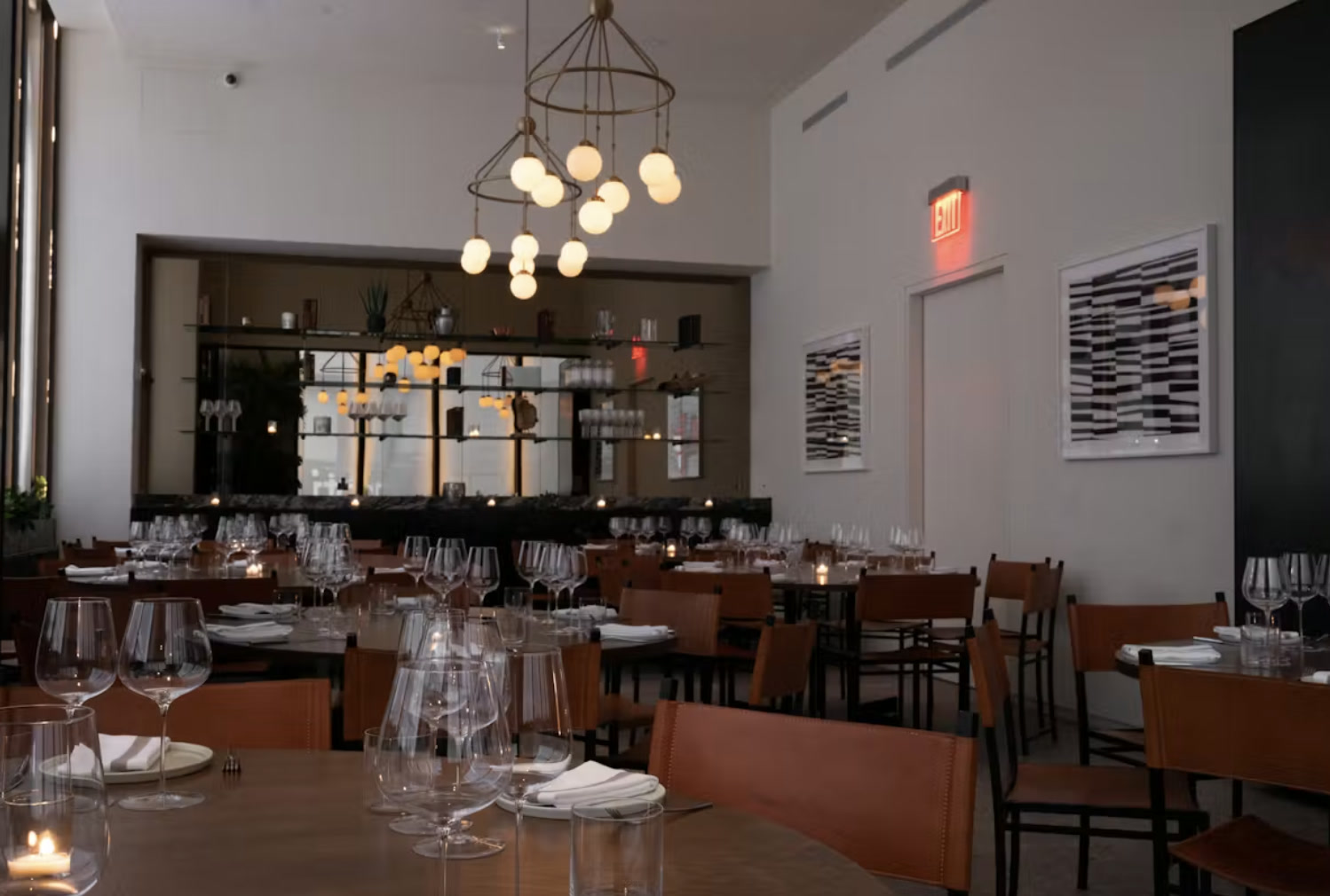 Elegant private dining room with chandelier and set tables